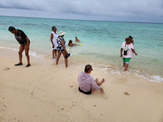 PUCC members on the beach, in the surf